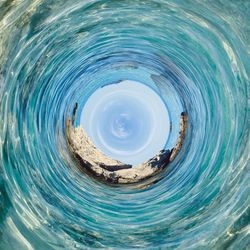 Digital composite image of blue sea against sky