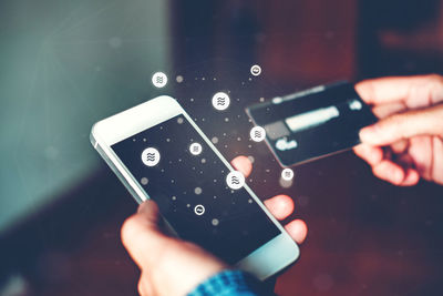 Close-up of man using mobile phone
