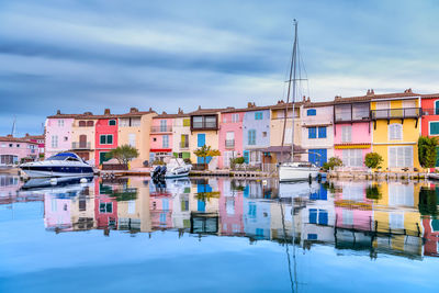 Scenic view of port grimaud village in south of france in autumn pastel colors against dramatic sky