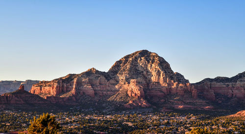 Panoramic desert landscape and mountains under blue sky