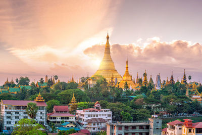 Panoramic view of buildings against sky during sunset