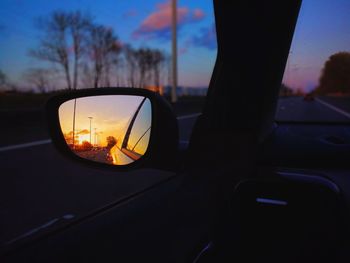 Reflection of car on side-view mirror