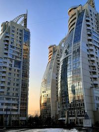 Low angle view of modern buildings against sky