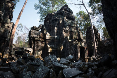 Low angle view of temple against trees