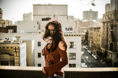 Young woman standing in park