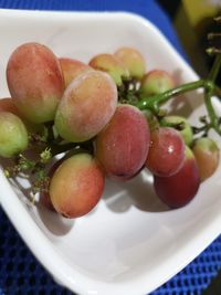 High angle view of fruits in plate on table