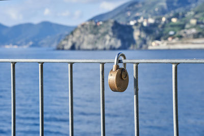 Close-up of padlocks on railing