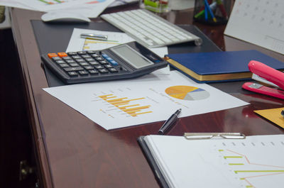 Close-up of office supplies at desk