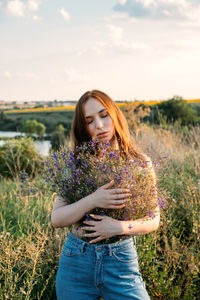 Healing power of nature, benefits of ecotherapy, nature impact wellbeing. happy young girl holding