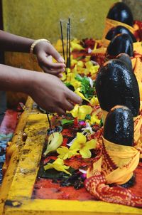 Close-up of hand holding food on table