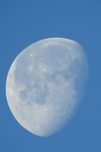 Close-up of moon against blue sky