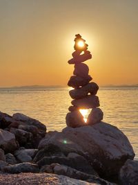 Close-up of statue against sky during sunset