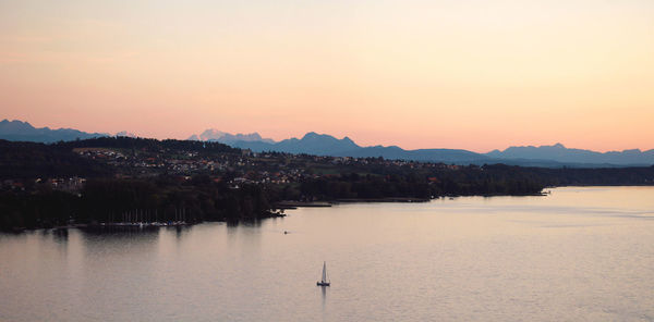 Scenic view of lake against sky during sunset