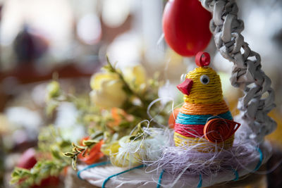 Handmade easter centerpiece in spring colors - a hen in the nest.