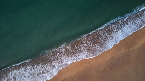 Close-up of water flowing over sea