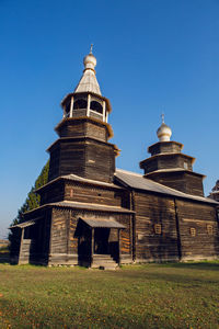 Old log church in russia in autumn