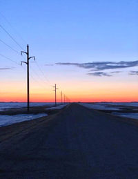 Road against sky during sunset