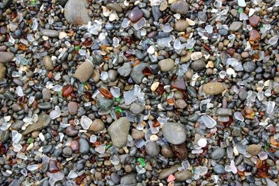 High angle view of pebbles on beach