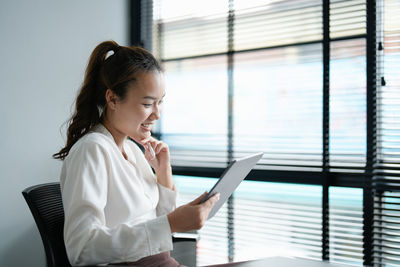 Young woman using mobile phone