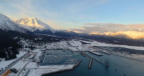 High angle view of snowcapped mountains against sky