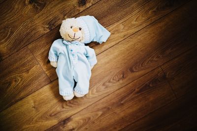 High angle view of stuffed toy on hardwood floor