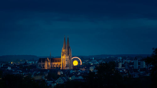 Illuminated buildings in city at night