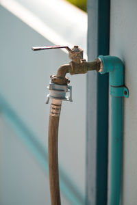 Close-up of pipes against wall