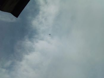 Low angle view of airplane flying in sky