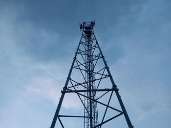 Low angle view of communications tower against sky