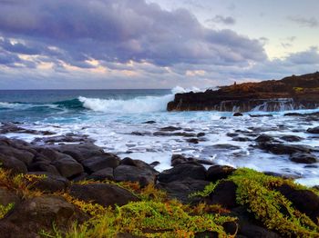 Scenic view of sea against cloudy sky