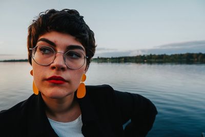 Woman wearing eyeglasses at lake
