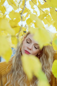 Portrait of young woman with yellow eyes