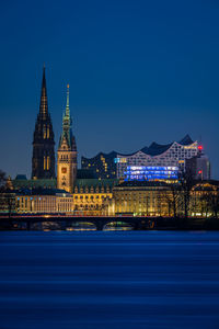 Illuminated buildings in city at night