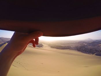 Cropped image of woman standing on landscape