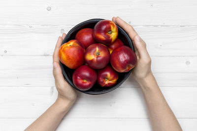 High angle view of apples in container on table