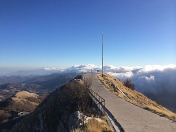 Scenic view of snowcapped mountains against blue sky