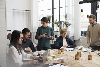 Business professionals discussing in meeting at office