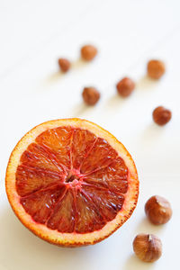 Close-up of orange slice against white background