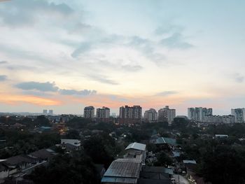 Cityscape against sky during sunset