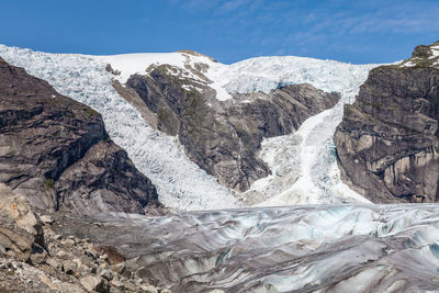 Scenic view of mountains against sky during winter