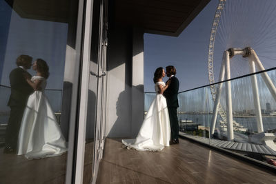 Low section of bride and groom walking on stage