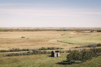 Scenic view of farm against sky