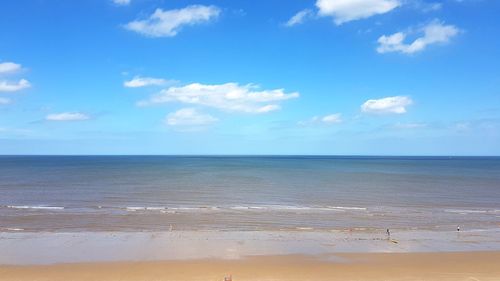 Scenic view of sea against blue sky