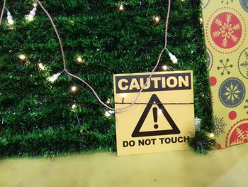 Close-up of information sign on christmas tree