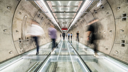 Blurred motion of people walking on subway station