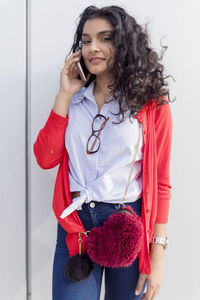 Portrait of young woman using mobile phone