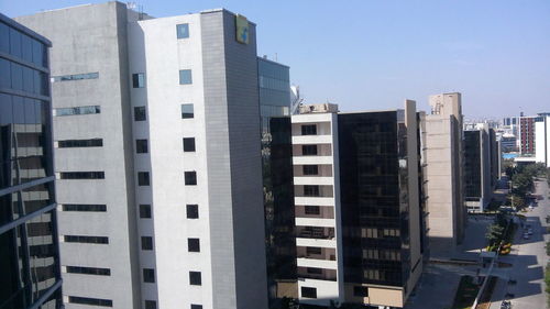 Low angle view of skyscrapers against clear sky