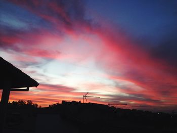 Low angle view of silhouette buildings against sky during sunset