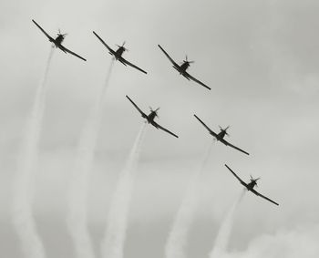 Low angle view of airplane flying in sky