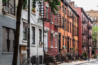 Buildings by street in city